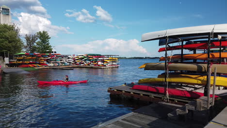 Wide-shot-of-colourful-stacked-kayaks-and-new-learners-at-the-Harbourfront-Canoe-and-Kayak-Centre