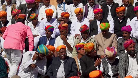 middle-aged-people-wearing-colorful-turban-sitting-to-watch-the-coronation-ceremony-of-the-king