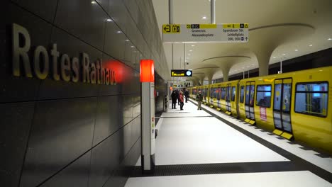 Modern-Train-Station-Rotes-Rathaus-with-Incoming-Yellow-Subway