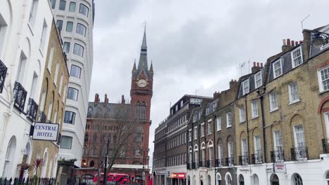 Street-of-London-near-the-St-Pancras-station-with-red-buses-at-the-end-of-the-street