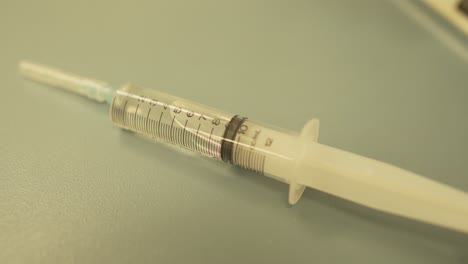 Close-view-of-10-ml-plastic-transparent-syringe-with-drug-medication-within-for-patient-treatment-in-hospital