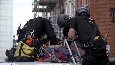 Officers-from-a-specialist-police-unit-on-top-a-van-being-used-as-a-road-block-prepare-specialist-tools-to-remove-two-Extinction-Rebellion-climate-change-protestors