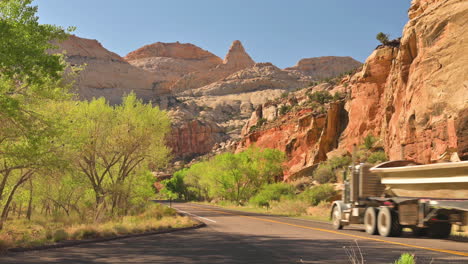 Highway-24-Through-Capitol-Reef-National-Park-With-Jeep-Passing-At-Narrow-Asphalt-Road-Near-Torrey,-Utah-State,-USA