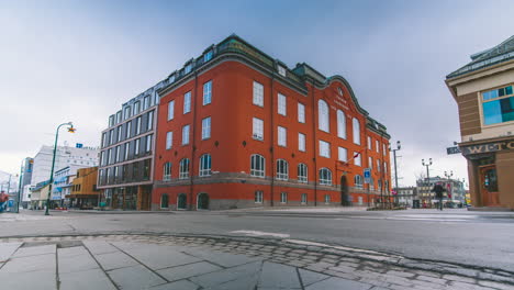 Bustling-activity-on-streets-outside-Tromso-Sparebank---long-exposure-time-lapse
