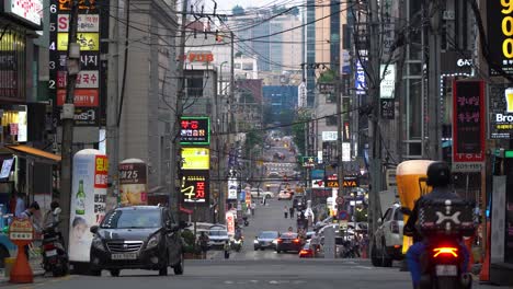 Delivery-on-Motorcycles-in-Old-Korean-street-in-Gangnam-during-2021-delta-plus-covid-19-coronavirus-pandemic-outbreak-at-sunset