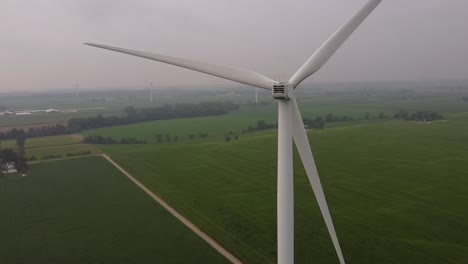 Wind-Turbine-From-Aerial-View---DTE-Wind-Farm,-Gratiot-Wind,-Ithaca-Michigan,-Gratiot-County---drone-shot