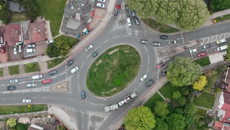 rotating-overhead-aerial-shot-of-a-busy-roundabout