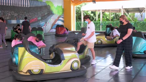 Visitors-enjoy-the-Bumper-Blaster-cars-ride-at-the-amusement-and-animal-theme-park-Ocean-Park-in-Hong-Kong