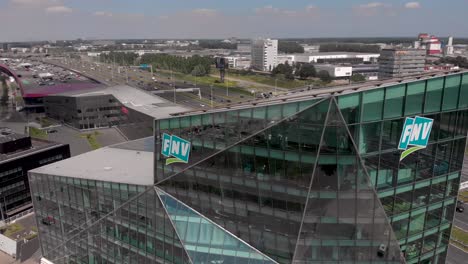 Contemporary-modern-glass-window-exterior-facade-of-the-Dutch-workers-association-in-Utrecht-next-to-highway