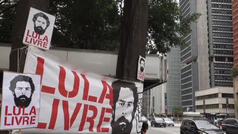Lula-Livre-banners-on-street-for-political-rally:-Sao-Paulo,-Brazil