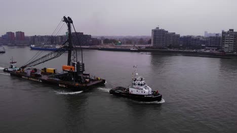 En-Avant-9-Tugboat-Pulling-Barge-With-Liebherr-Crane-Along-Oude-Maas