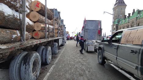 Tracking-motion-through-wood-log-Truck-on-freedom-Convoy-protest-in-front-of-the-Canadian-Parliament