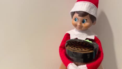 Elf-on-the-Shelf,-a-popular-kids-toy-being-mischievous-and-naughty