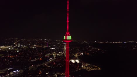 AERIAL:-Vilnius-TV-Tower-Shines-with-Bright-Colours-during-Night-of-Re-establishment-of-the-State-of-Lithuania