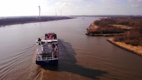 Aerial-View-Of-Stern-Of-WEC-de-Hoogh-Cargo-Ship-Navigating-Along-Oude-Maas