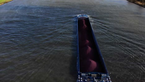 Aerial-View-Of-Sjouwer-Cargo-Vessel-Transporting-Materials-Along-Oude-Maas-In-Zwijndrecht