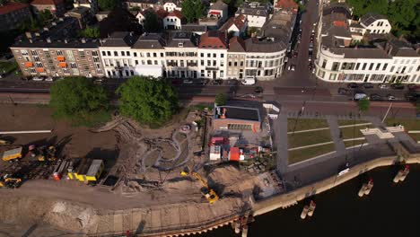 Aerial-view-of-quay-under-construction-seen-from-above-river-IJssel-with-work-in-progress-on-the-IJsselkade-boulevard-of-tower-town-Zutphen-urban-development
