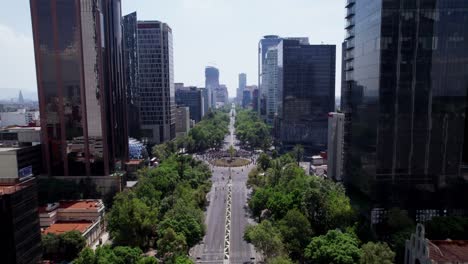 Aerial-Flying-Over-Reforma-Avenue-Towards-Glorieta-De-La-Palma-Roundabout-With-Crowds-To-See-The-New-Ahuehuete-Tree-Guardian-of-Missing-Persons-Mexico-City