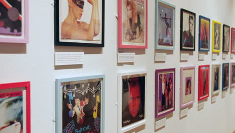 A-collection-of-1980s-music-with-pop-record-albums-cover-artwork-displayed-on-a-wall