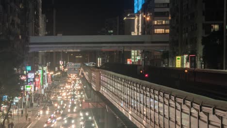 Time-lapse-of-traffic-and-MRT-at-night-in-Taipei,-Taiwan