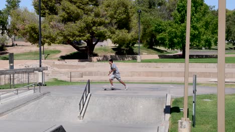 Boy-skateboards-across-the-Wedge-Skate-Park,-Scottsdale-Arizona