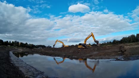 Excavators-are-working-with-Buckets-to-Clear-Mud-Sludge-and-Debris-from-the-Bottom-of-the-Drained-River