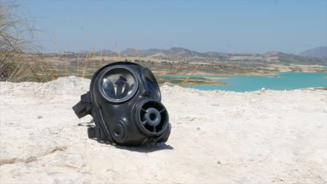 Post-Apocalyptic-desert-with-a-discarded-gas-mask