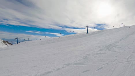 Surface-ski-lift-and-skiers-on-a-ski-resort
