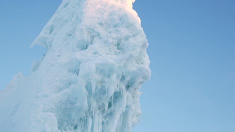Close-up-of-tall-iceberg-in-a-remote-town-in-northern-sweden,-shot-on-tripod