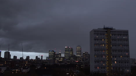 UK-November-2018---A-time-lapse-of-the-dark-and-menacing-clouds-of-Storm-Deirdre-passing-over-Canary-Wharf-financial-district-in-London
