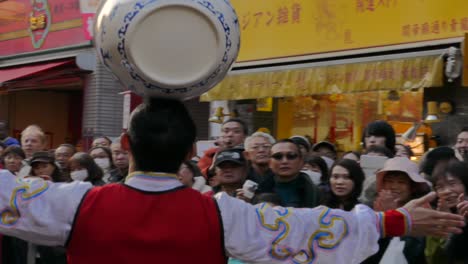 February-24,-2018,-Tokyo,-Japan---People-look-at-a-participant-performing-during-the-Chinese-New-Year-Parade-2018-in-Yokohama's-Chinatown