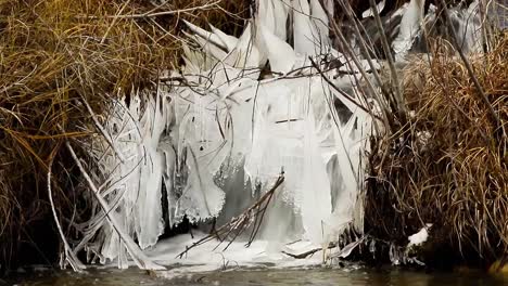Splash-ice-formed-by-a-waterfall-from-a-side-channel-to-the-Bow-River-in-winter
