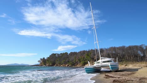 Stranded-catamaran-on-sand-beach