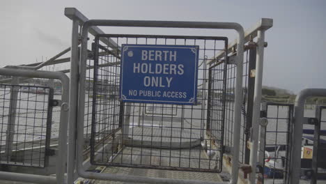 Smooth-camera-movement-past-a-'Berth-Holders-Only'-sign