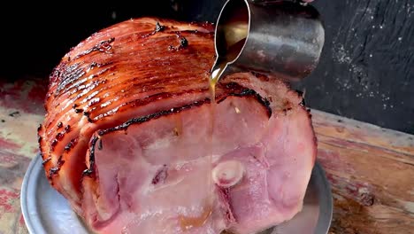 pouring-syrup-glaze-over-baked-spiral-cut-ham