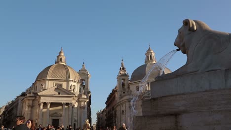 The-twin-churches-in-people’s-square-in-Rome-with-lions-fountain-in-foreground-in-slow-motion