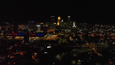 aerial-footage-downtown-Minneapolis,-Minnesota-at-night