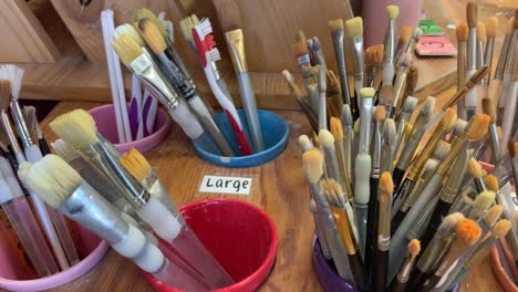 An-array-of-clean-paintbrushes-to-choose-from-at-"Color-Me-Mine"-Art-and-Pottery-studio-in-Saratoga,-California