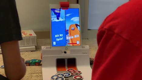 A-close-up-video-of-two-boys-playing-the-OSMO-Hot-Wheels-Mindracers-game-together