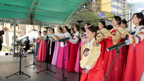 korean-people-with-hanbok-doing-orchestra-on-stage-during-korean-festival