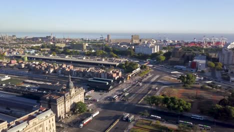 Orbital-shot-of-Retiro-railway-station-with-Buenos-Aires-buildings-and-Rio-de-la-Plat-in-background