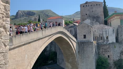 People-walking-over-Old-bridge-in-Mostar