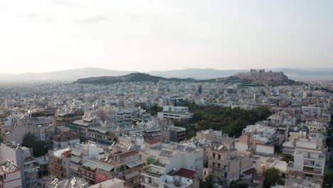 Drone-aerial-ascending-flight-with-view-of-the-Acropolis-in-Athens,-Greece