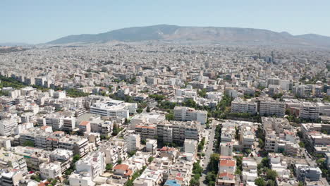Aerial-wide-shot-of-the-urban-city-of-Athens,-Greece