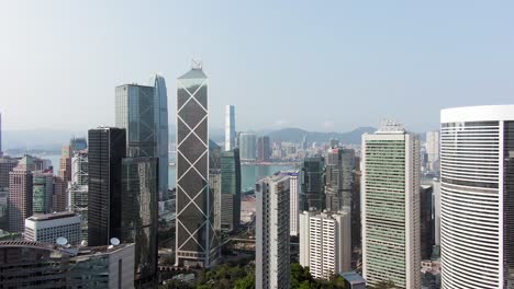 Hong-Kong-upscale-Wan-Chai-district-and-Victoria-Harbour-skyscrapers,-Aerial-view