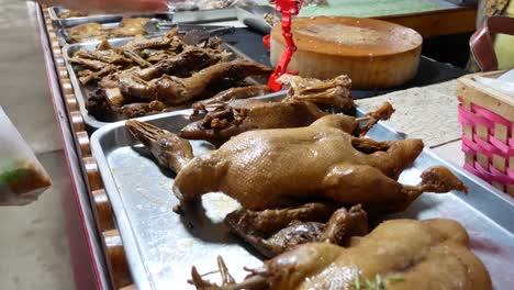 Close-up-Footage-of-Street-Food-Vendor-Displaying-Chinese-Stewed-Duck-On-Stainless-Tray