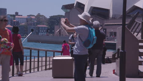 Many-people-on-vacation-in-Australia-take-photos-are-the-waterfront-near-the-Sydney-Harbor-bridge