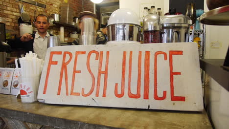 Boss-and-Employee-Behind-the-Counter-at-a-New-Fresh-Juice-Cleanse-Bar