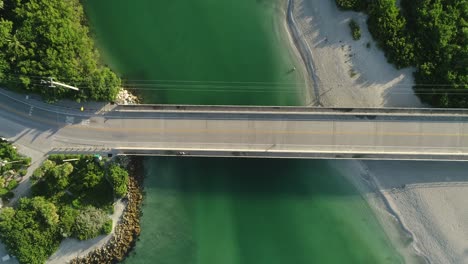 Captiva,-FL---USA---8-12-2020:-Top-down-aerial-footage-pushing-in-toward-the-bridge-over-the-blind-pass-channel-in-Captiva-Island