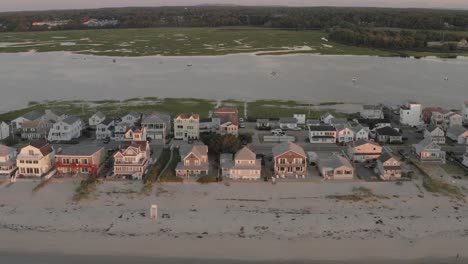 Well-Beach-real-estate-housing-stretching-along-shoreline-Sunrise-aerial